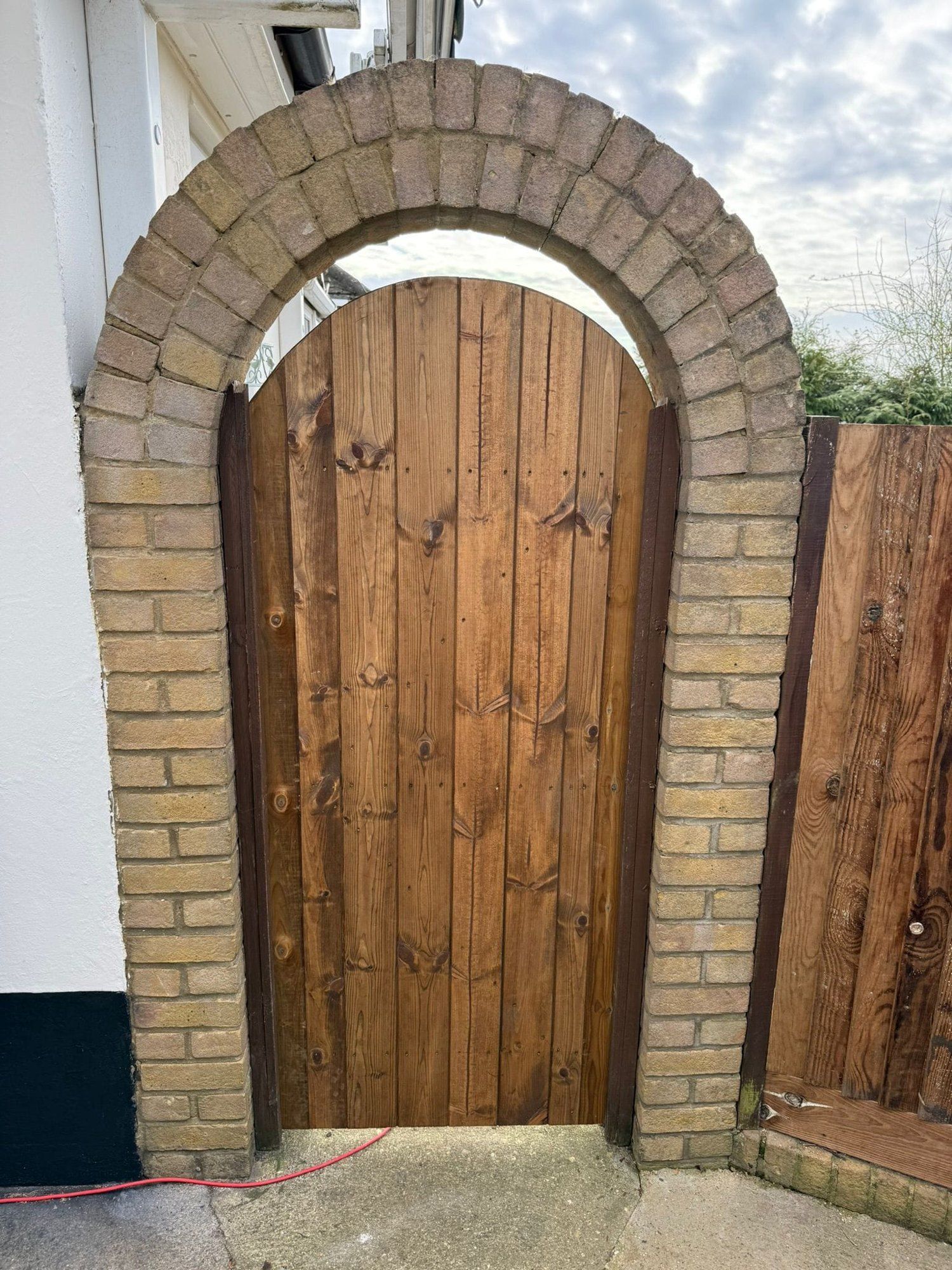 Arched brick garden gate