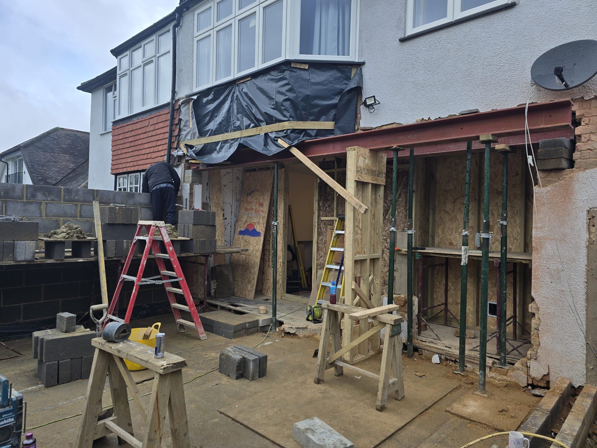 Propped while the wall goes in